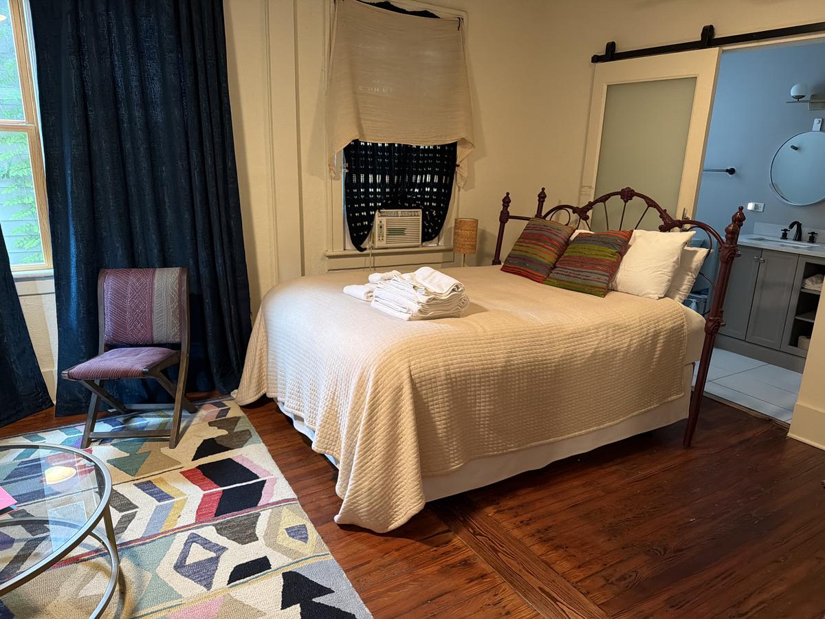 Downtown Savannah Airbnb studio bedroom cleaned and staged by Live Oak Home Cleaning