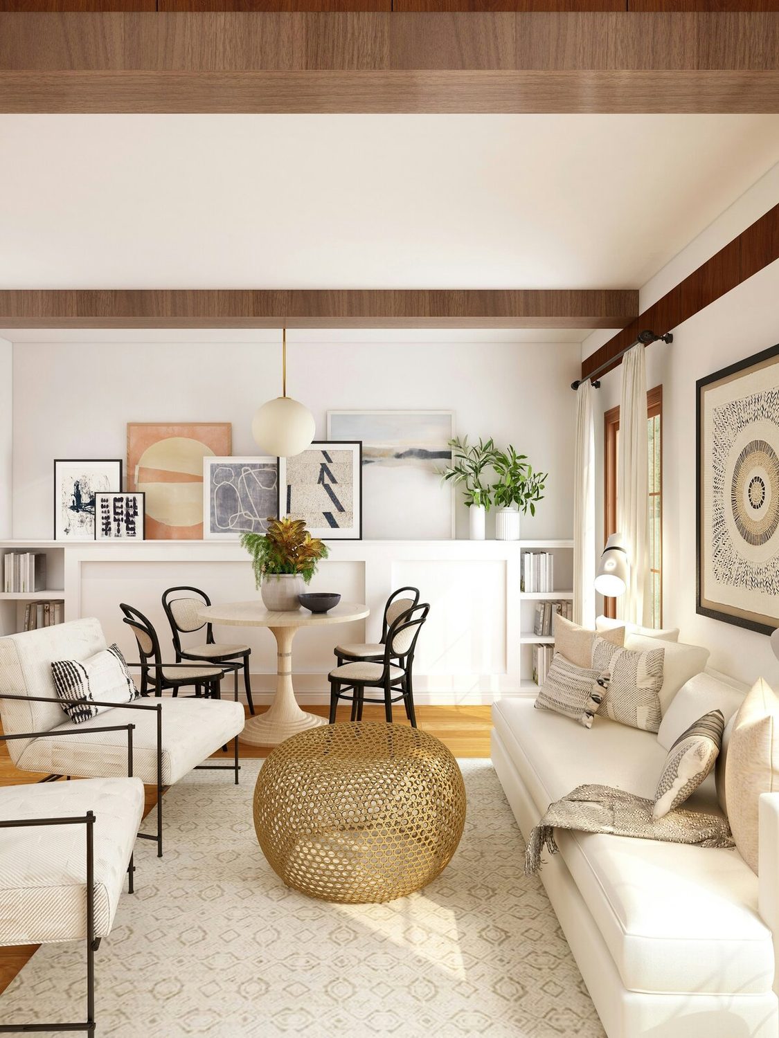Bright, airy coastal living room with hardwood floors, white walls, wood beams, and natural light